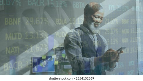 Image of financial data processing over african american businessman using smartphone. Global finance, business, connections, computing and data processing concept digitally generated image. - Powered by Shutterstock