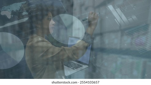 Image of financial data processing over diverse business people in office. Global finance, business, connections, computing and data processing concept digitally generated image.