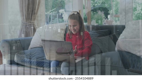 Image of financial data processing over caucasian girl using laptop. Childhood, finances, communication and digital interface concept digitally generated image.