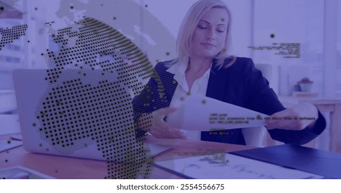 Image of financial data processing over caucasian businesswoman using laptop in office. Global finance, business, connections, computing and data processing concept digitally generated image.