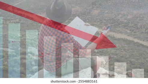 Image of financial data processing over caucasian man reading map in mountains. Global travel, finances, computing and digital interface concept digitally generated image. - Powered by Shutterstock