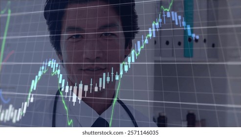 Image of financial data processing over asian male doctor in hospital. Global medicine, connections, computing and data processing concept digitally generated image.
