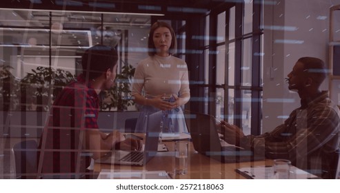 Image of financial data processing over diverse colleagues having meeting in office. Global business, computing, communication and digital interface concept digitally generated image.