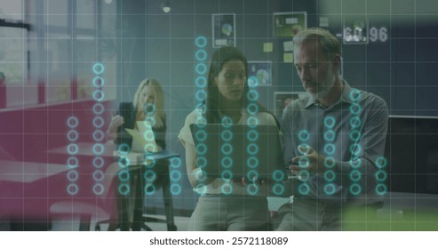 Image of financial data processing over diverse colleagues discussing work in office. Global business, computing, communication and digital interface concept digitally generated image.