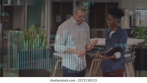 Image of financial data processing over diverse colleagues discussing work in office. Global business, computing, communication and digital interface concept digitally generated image.