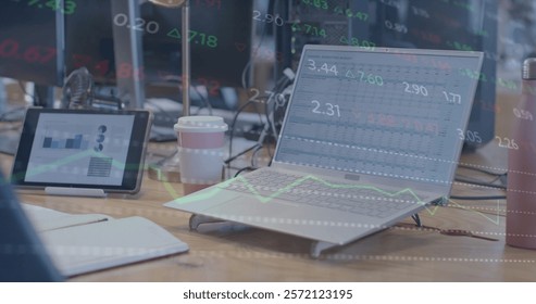 Image of financial data processing over computer on desk in office. Global finance, business, connections, computing and data processing concept digitally generated image.