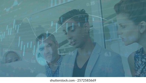 Image of financial data processing over diverse business people in office. Global finance, business, connections, computing and data processing concept digitally generated image.