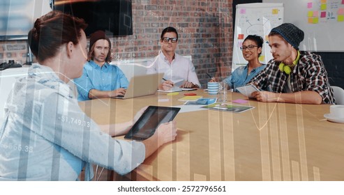 Image of financial data processing over diverse business people in office. Global finance, business, connections, computing and data processing concept digitally generated image.