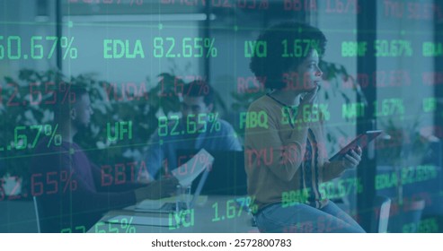 Image of financial data processing over diverse business people in office. Global finance, business, connections, computing and data processing concept digitally generated image.