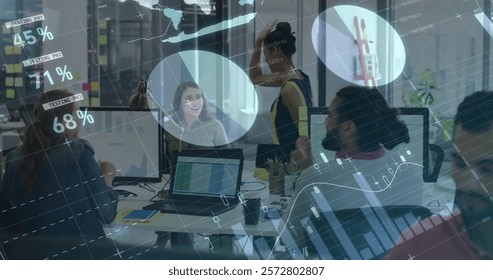 Image of financial data processing over diverse business people in office. Global finance, business, connections, computing and data processing concept digitally generated image.