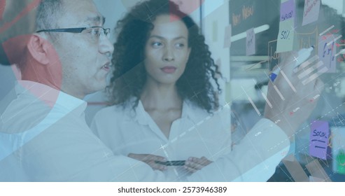 Image of financial data processing over diverse colleagues discussing work in office. Global business, finances, computing and digital interface concept digitally generated image.