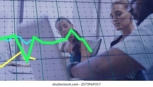 Image of financial data processing over diverse colleagues discussing work in office. Global business, finances, computing and digital interface concept digitally generated image.