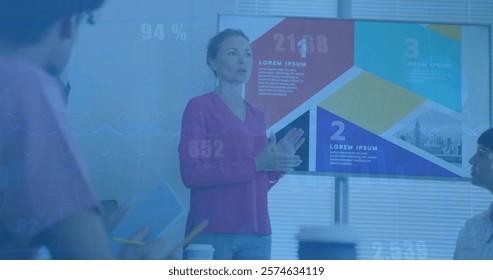 Image of financial data processing over diverse business people in office. Global finance, business, connections, computing and data processing concept digitally generated image.
