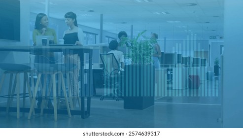 Image of financial data processing over diverse business people in office. Global finance, business, connections, computing and data processing concept digitally generated image.