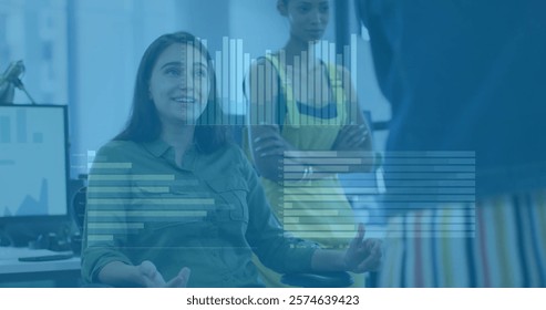Image of financial data processing over diverse business people in office. Global finance, business, connections, computing and data processing concept digitally generated image.