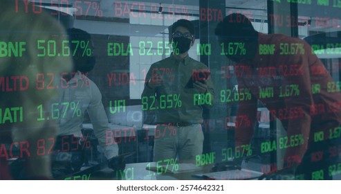 Image of financial data processing over diverse business people in office. Global finance, business, connections, computing and data processing concept digitally generated image.