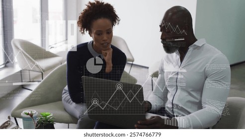 Image of financial data processing over diverse business people in office. Global finance, business, connections, computing and data processing concept digitally generated image.
