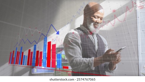Image of financial data processing over african american businessman using smartphone. Global finance, business, connections, computing and data processing concept digitally generated image.