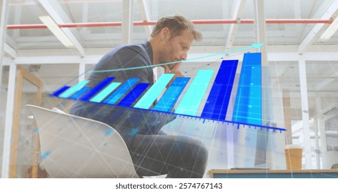 Image of financial data processing over caucasian businessman using smartphone. Global finance, business, connections, computing and data processing concept digitally generated image.