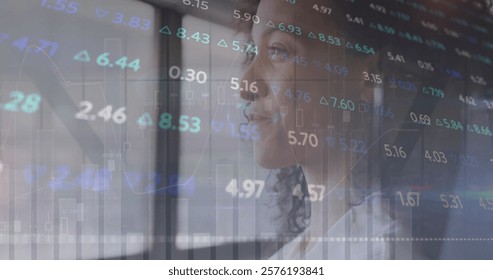 Image of financial data processing over biracial businesswoman in office. Global finance, business, connections, computing and data processing concept digitally generated image.