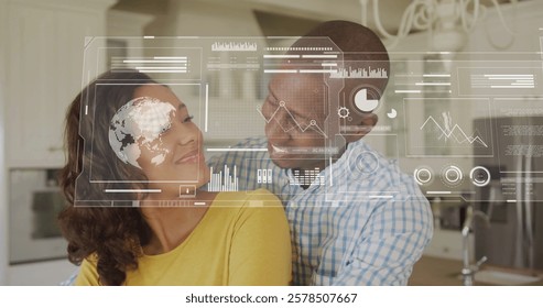 Image of financial data processing over biracial couple in kitchen. Global finance, business, connections, computing and data processing concept digitally generated image.