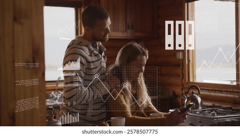 Image of financial data processing over biracial couple in kitchen. Global finance, business, connections, computing and data processing concept digitally generated image.