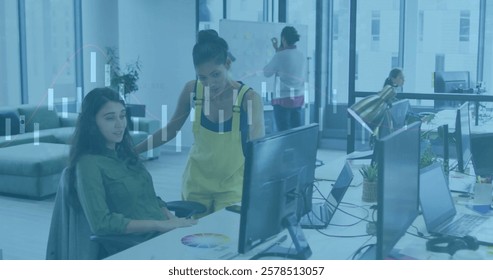 Image of financial data processing over diverse business people in office. Global finance, business, connections, computing and data processing concept digitally generated image.