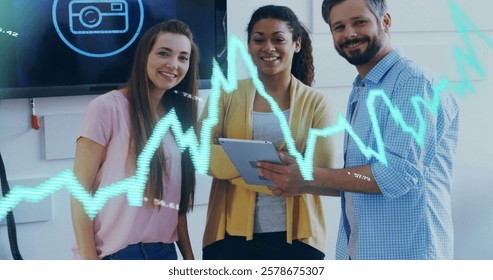 Image of financial data processing over diverse colleagues discussing work in office. Global business, finances, computing and digital interface concept digitally generated image.