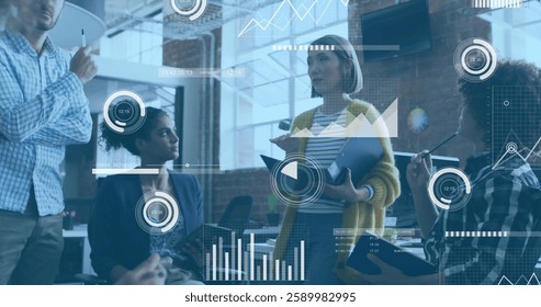 Image of financial data processing over diverse colleagues having meeting in office. Global business, finances and digital interface concept digitally generated image.