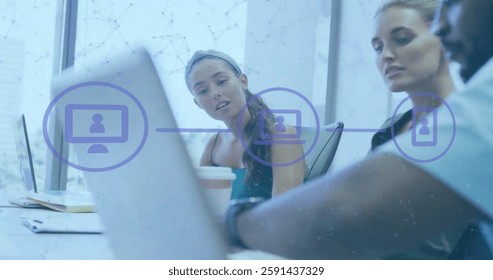 Image of financial data processing over diverse business people using laptop in office. Global finance, business, connections, computing and data processing concept digitally generated image.