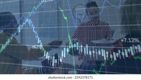 Image of financial data processing over diverse colleagues discussing work in office. Global business, finances, computing and digital interface concept digitally generated image.