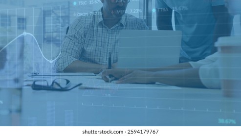 Image of financial data processing over diverse colleagues discussing work in office. Global office, finances, computing and digital interface concept digitally generated image.