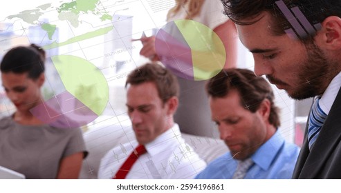 Image of financial data processing over diverse colleagues having meeting in office. Global business, finances, computing and digital interface concept digitally generated image.