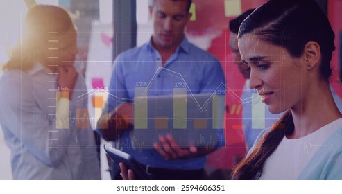 Image of financial data processing over diverse business people in office. Global finance, business, connections, computing and data processing concept digitally generated image.