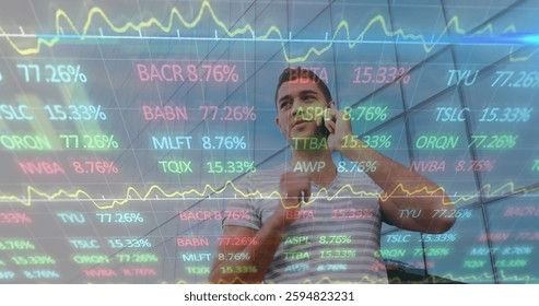 Image of financial data processing over biracial man talking on smartphone. Global business, finances, communication, computing and digital interface concept digitally generated image.