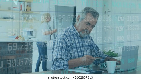 Image of financial data processing over senior man paying online using laptop. Global business and finance concept digitally generated image. - Powered by Shutterstock - Get 15% off with code: PIKWIZARD15
