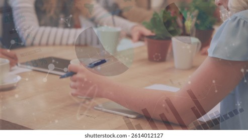 Image of financial data processing over businesswoman writing in office. global business, data processing and digital interface concept digitally generated image.