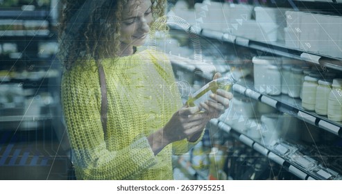 Image of financial data processing over caucasian women shopping. Global shopping, business, finances, data processing and digital interface concept digitally generated image.