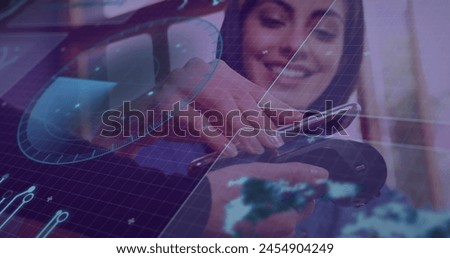 Image of financial data processing over caucasian womenusing payment terminal. global business, finances, data processing and digital interface concept digitally generated image.