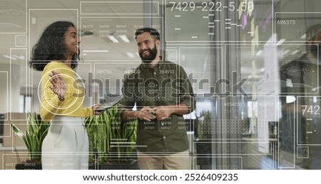 Image of financial data processing over diverse businesspeople in office. Global business, finances, computing and data processing concept digitally generated image.