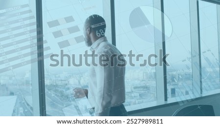 Image of financial data processing over african american businessman thinking. global business, finances and digital interface concept digitally generated image.
