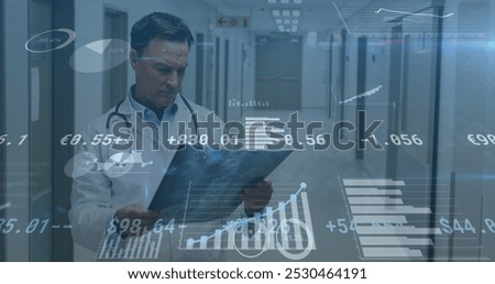 Image of financial data processing over caucasian male doctor with x ray scan. global medicine, healthcare services and data processing concept digitally generated image.