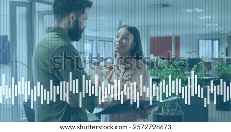 Image of financial data processing over diverse business people in office. Global finance, business, connections, computing and data processing concept digitally generated image.