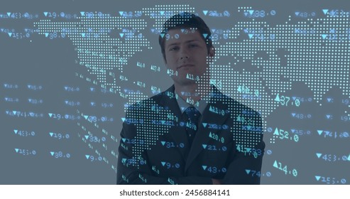 Image of financial data and world map over happy caucasian businessman. global business, finance, economy and technology concept digitally generated image.