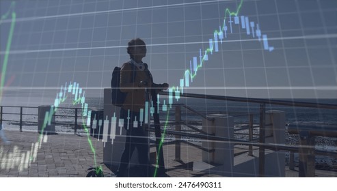 Image of financial graph, and data over aftican american woman with scooter at sea. global finance, economy and technology concept digitally generated image. - Powered by Shutterstock