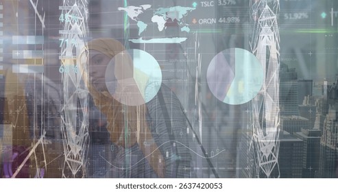Image of financial graph and data processing over muslim businesswomen. Global business, finances, data processing and digital interface concept digitally generated image.
