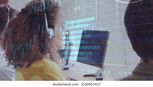 Image of financial graphs and data over happy biracial female call center worker. Business, call center, finance, economy and working with technology concept digitally generated image.