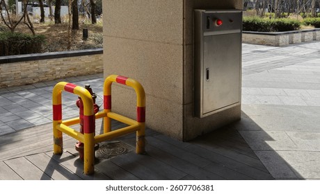 Image of a fire hydrant guard installed on the outside of a building