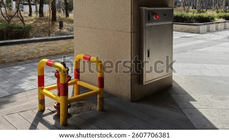 Image of a fire hydrant guard installed on the outside of a building