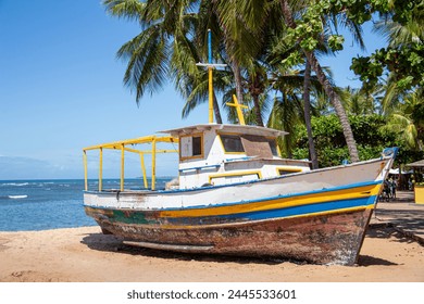 Image of a fisherman's boat in the sand of Praia do Forte in Bahia Brazil - Powered by Shutterstock